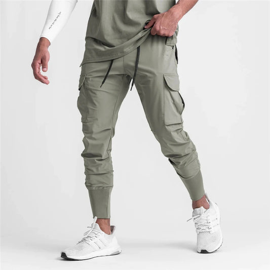 Jogger nowe fitness męskie spodnie sportowe streetwearne odzież na zewnątrz Casualne spodnie bawełniane męskie spodnie mody marki odzież męską