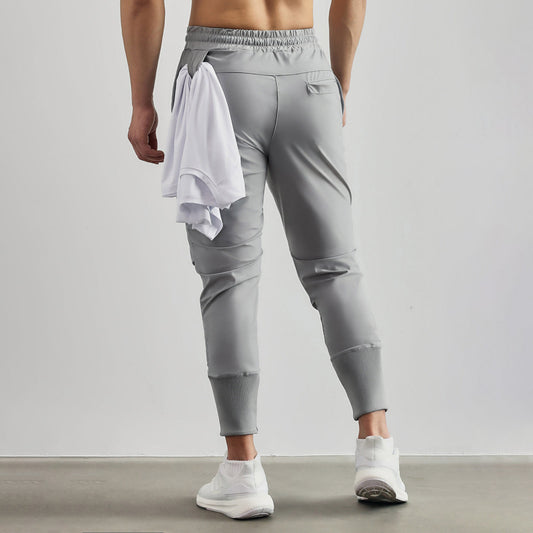 Pantalón elástico de jogger elástico para hombres con diseño de cremallera